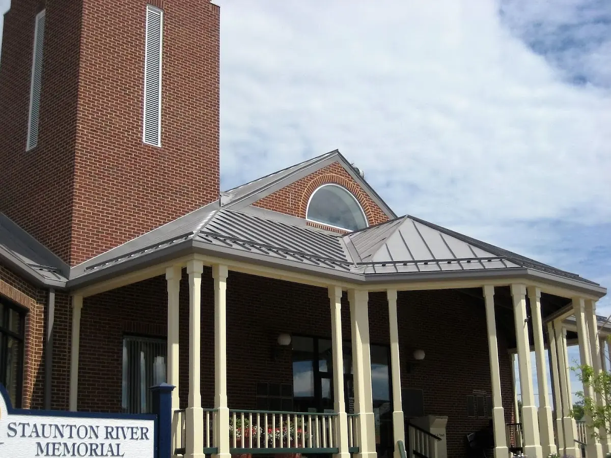 Skilled roofing craftsmen working on a residential roof in Medway